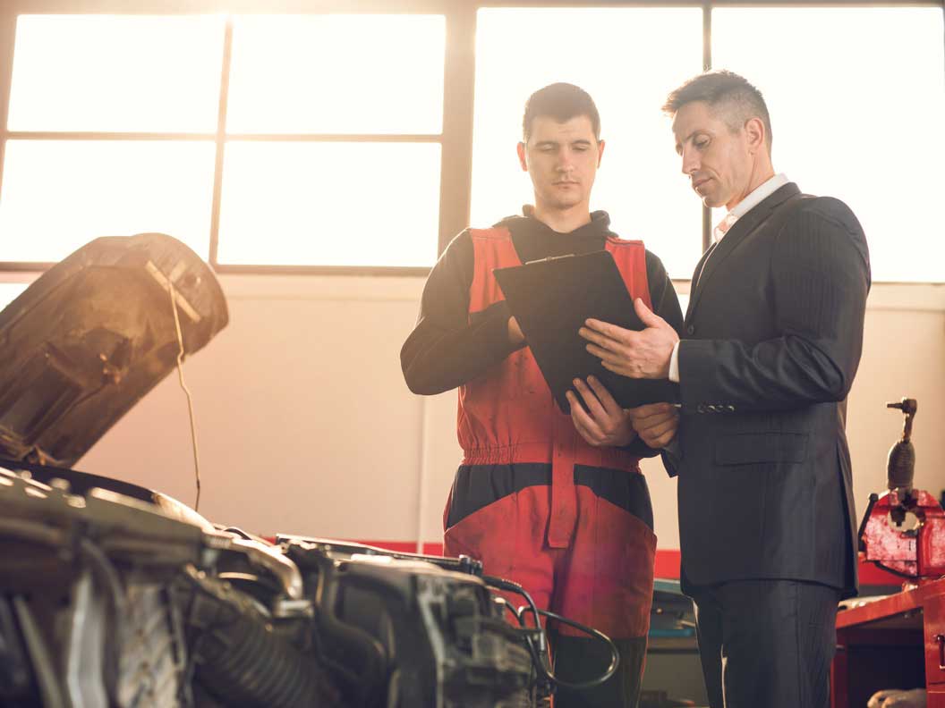 Diesel engine specialist consults with a customer. 