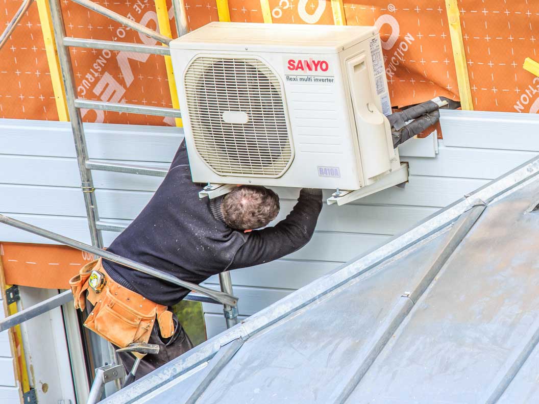 A heating, air conditioning and refrigeration mechanic installs an HVAC system.