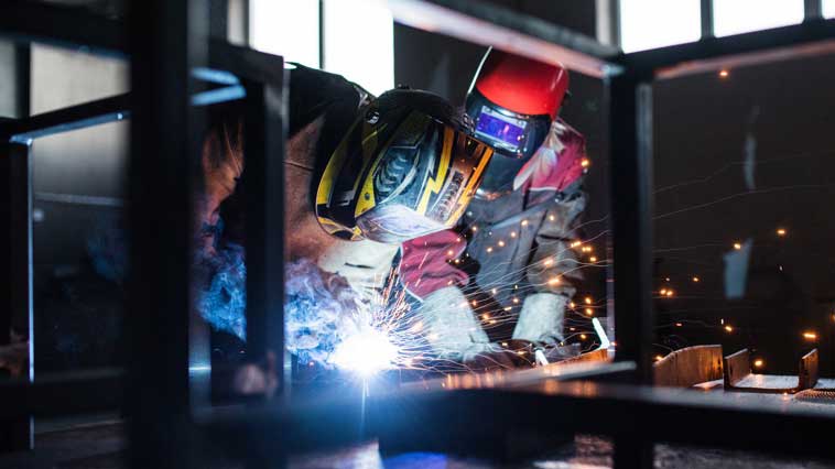Welders monitor a welding process to avoid overheating. 